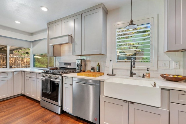 5310 Fort Clark Dr, Austin, TX 78745 - kitchen with appliances with stainless steel finishes, a sink, healthy amount of natural light, light countertops, and recessed lighting