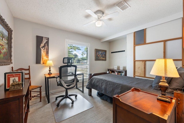 5310 Fort Clark Dr, Austin, TX 78745 - carpeted bedroom featuring a textured ceiling, an office area, baseboards, and ceiling fan
