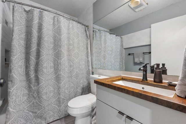 5310 Fort Clark Dr, Austin, TX 78745 - full bathroom featuring a textured ceiling, toilet, and vanity