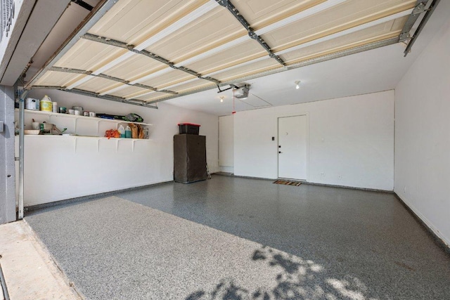 5310 Fort Clark Dr, Austin, TX 78745 - garage with a garage door opener and baseboards