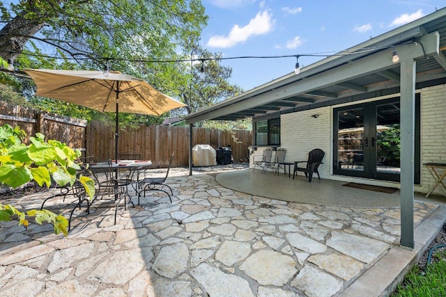 5310 Fort Clark Dr, Austin, TX 78745 - view of patio / terrace with french doors and outdoor dining area