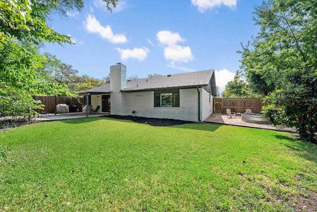5310 Fort Clark Dr, Austin, TX 78745 - back of property featuring a patio, a chimney, and brick siding