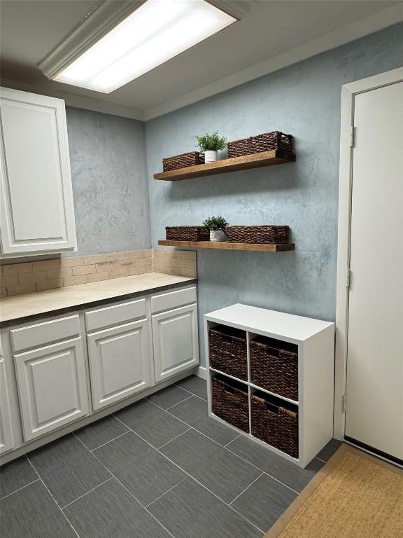 5310 Fort Clark Dr, Austin, TX 78745 - kitchen with white cabinetry, light countertops, and open shelves