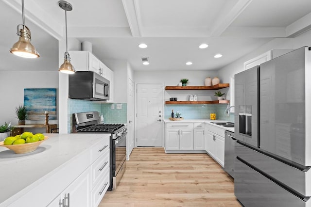 7003 Priscilla Dr, Austin, TX 78752 - kitchen featuring appliances with stainless steel finishes, open shelves, recessed lighting, light wood-style flooring, and beamed ceiling