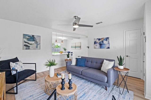 7003 Priscilla Dr, Austin, TX 78752 - living room with light wood finished floors and ceiling fan