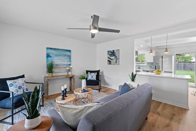 7003 Priscilla Dr, Austin, TX 78752 - living area featuring light wood-type flooring and a ceiling fan