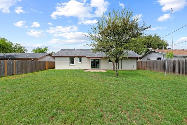 7003 Priscilla Dr, Austin, TX 78752 - rear view of house with a fenced backyard and a patio