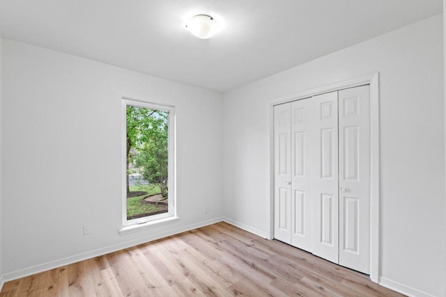 7003 Priscilla Dr, Austin, TX 78752 - unfurnished bedroom featuring light wood-style flooring and a closet