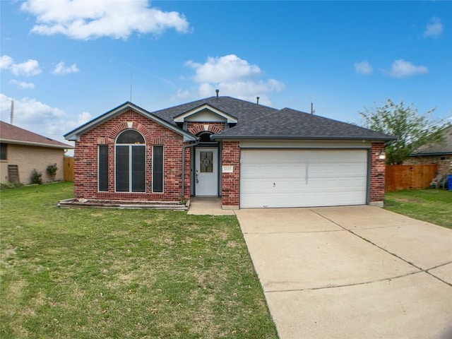 1608 Mallard Ln, Taylor, TX 76574 - ranch-style home with brick siding, concrete driveway, an attached garage, and roof with shingles