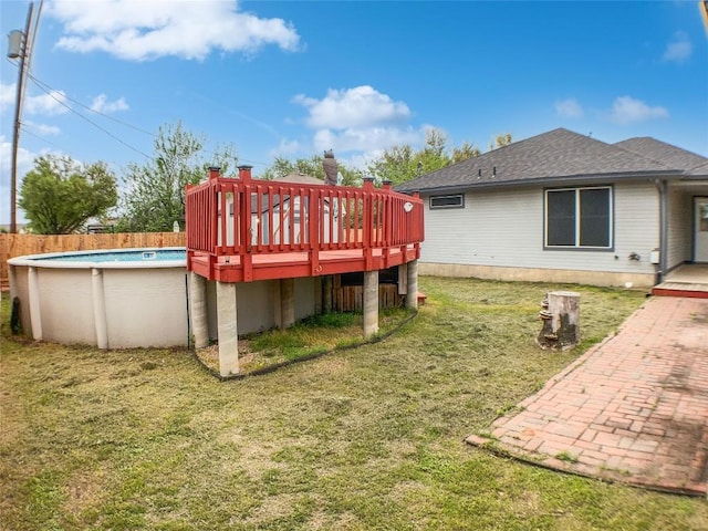 1608 Mallard Ln, Taylor, TX 76574 - rear view of property with a wooden deck and a shingled roof