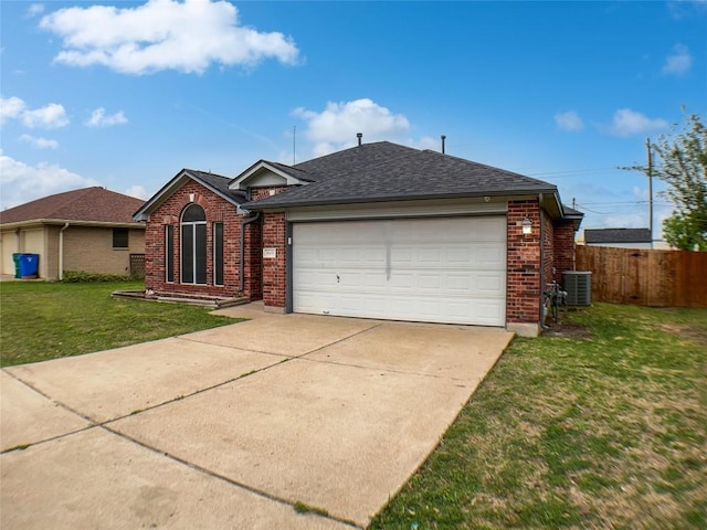 1608 Mallard Ln, Taylor, TX 76574 - single story home with brick siding, an attached garage, concrete driveway, and a shingled roof