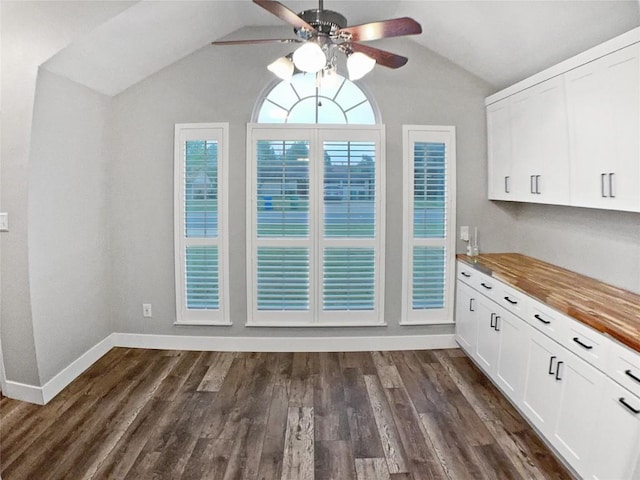 1608 Mallard Ln, Taylor, TX 76574 - unfurnished dining area with ceiling fan, lofted ceiling, and dark wood-type flooring