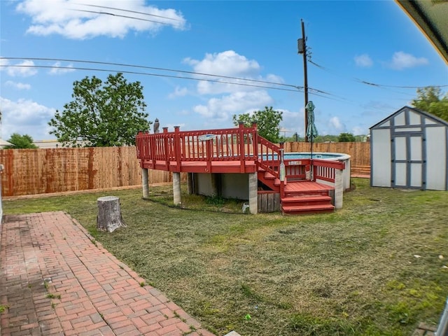 1608 Mallard Ln, Taylor, TX 76574 - fenced backyard with a storage unit and a deck