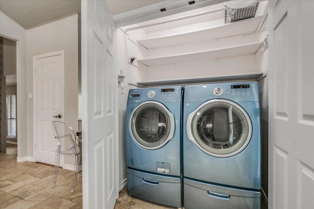 7306 Fireoak Dr, Austin, TX 78759 - laundry room featuring independent washer and dryer and stone finish flooring