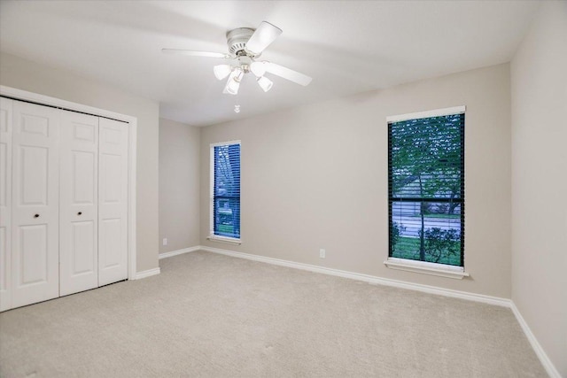 7306 Fireoak Dr, Austin, TX 78759 - unfurnished bedroom with carpet, a closet, and ceiling fan