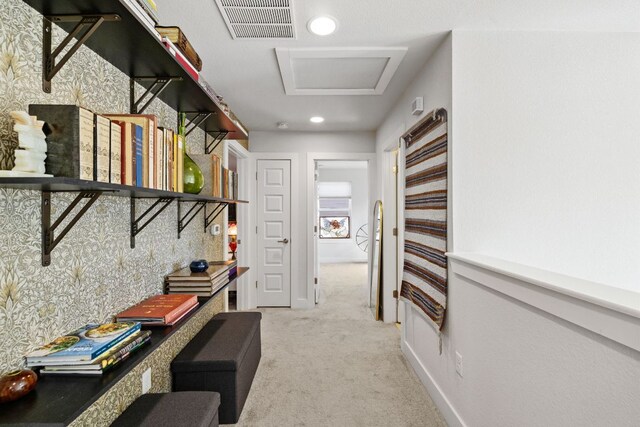 1900 Teagle Dr, Austin, TX 78741 - hallway featuring attic access, light carpet, and recessed lighting