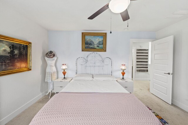 1900 Teagle Dr, Austin, TX 78741 - bedroom with light carpet, baseboards, and a ceiling fan