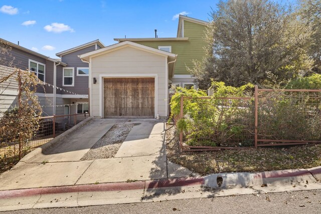 1900 Teagle Dr, Austin, TX 78741 - view of front of house with concrete driveway and a garage