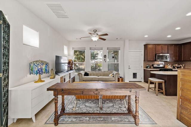 1900 Teagle Dr, Austin, TX 78741 - living area featuring a ceiling fan, recessed lighting, and light tile patterned floors