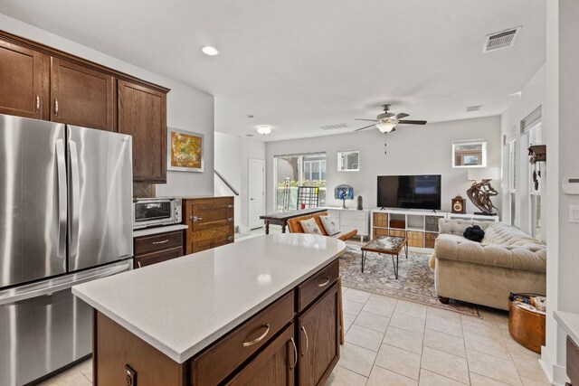 1900 Teagle Dr, Austin, TX 78741 - kitchen with freestanding refrigerator, open floor plan, ceiling fan, light countertops, and recessed lighting