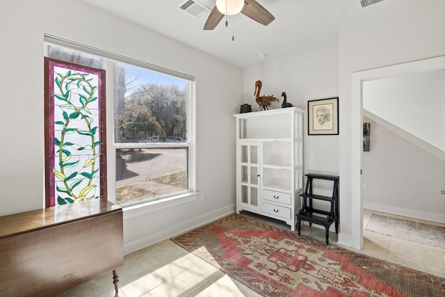 1900 Teagle Dr, Austin, TX 78741 - living area with tile patterned floors, ceiling fan, and baseboards