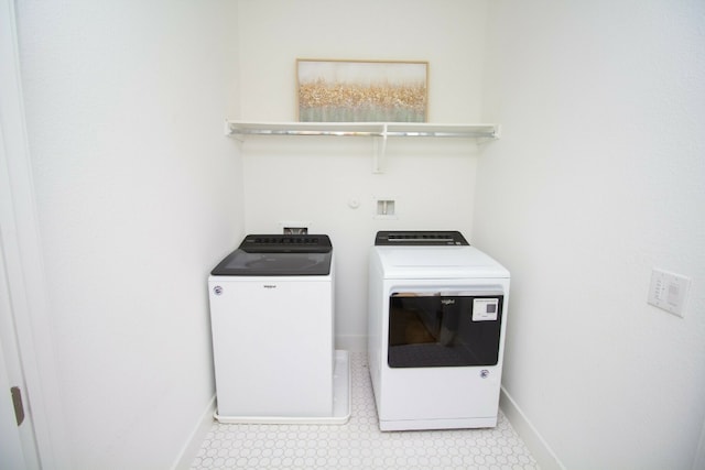 6221 Florencia Ln, Austin, TX 78724 - washroom featuring washer and clothes dryer and light flooring