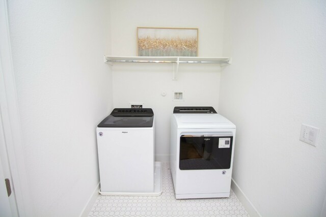 6221 Florencia Ln, Austin, TX 78724 - washroom featuring washer and dryer and light flooring