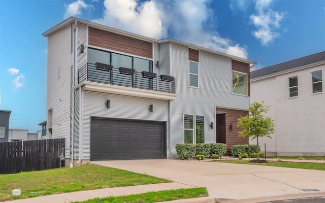 6221 Florencia Ln, Austin, TX 78724 - contemporary home with an attached garage, a balcony, and driveway