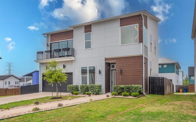 6221 Florencia Ln, Austin, TX 78724 - modern home with a balcony, a garage, and concrete driveway
