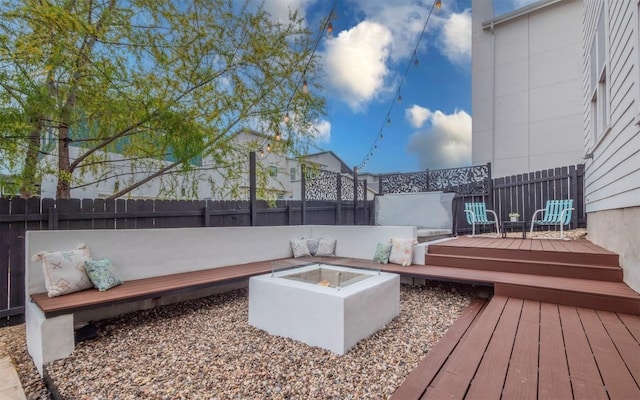 6221 Florencia Ln, Austin, TX 78724 - wooden deck with a fenced backyard and an outdoor fire pit
