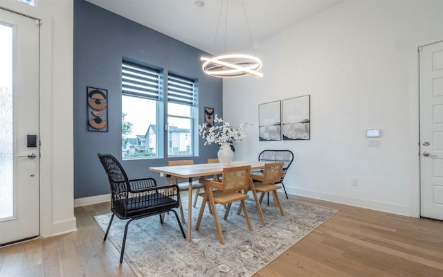 6221 Florencia Ln, Austin, TX 78724 - dining area featuring a chandelier and light wood-style flooring