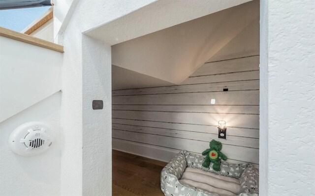 6221 Florencia Ln, Austin, TX 78724 - detailed view of wood finished floors, a textured wall, and a smoke detector