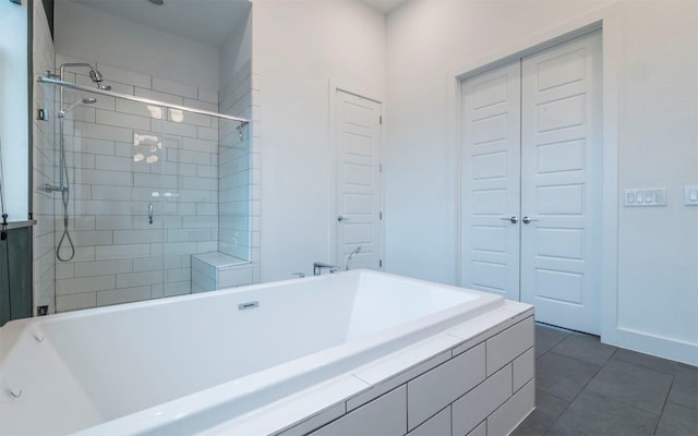6221 Florencia Ln, Austin, TX 78724 - full bath with tile patterned floors, a shower stall, and a tub to relax in