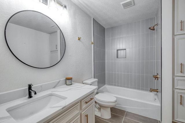 313 Lucy Ln, Horseshoe Bay, TX 78657 - full bath with a textured ceiling, vanity, a textured wall, tile patterned flooring, and tub / shower combination