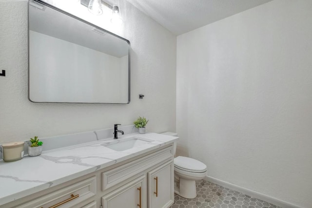 313 Lucy Ln, Horseshoe Bay, TX 78657 - half bath featuring toilet, vanity, and baseboards