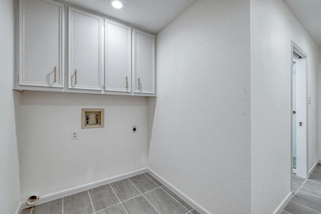 313 Lucy Ln, Horseshoe Bay, TX 78657 - washroom with hookup for an electric dryer, cabinet space, washer hookup, baseboards, and recessed lighting