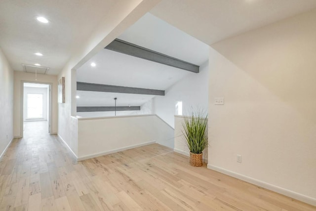 313 Lucy Ln, Horseshoe Bay, TX 78657 - unfurnished living room featuring attic access, beamed ceiling, recessed lighting, wood finished floors, and baseboards