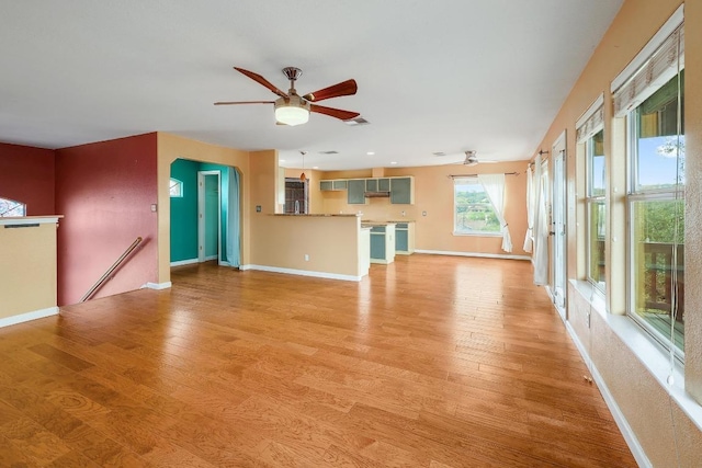 4142 Rockwood Dr, Lago Vista, TX 78645 - unfurnished living room with a ceiling fan and light wood-style floors