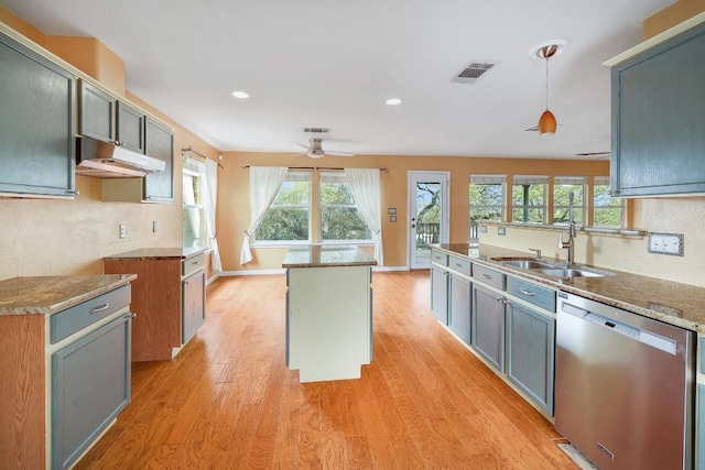 4142 Rockwood Dr, Lago Vista, TX 78645 - kitchen with stainless steel dishwasher, under cabinet range hood, a ceiling fan, light wood-style flooring, and recessed lighting