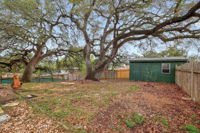 4142 Rockwood Dr, Lago Vista, TX 78645 - fenced backyard featuring a shed