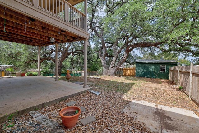 4142 Rockwood Dr, Lago Vista, TX 78645 - fenced backyard featuring a patio and an outdoor structure