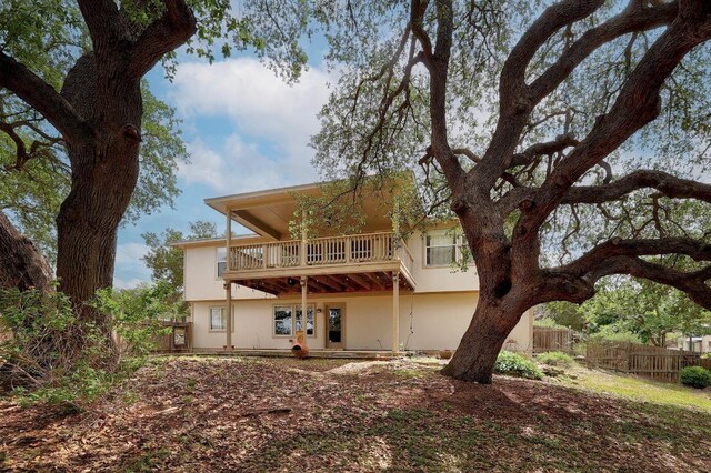 4142 Rockwood Dr, Lago Vista, TX 78645 - rear view of property featuring a balcony and stucco siding