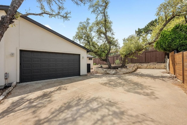 509 Flamingo Blvd, Lakeway, TX 78734 - view of home's exterior with a garage and stucco siding