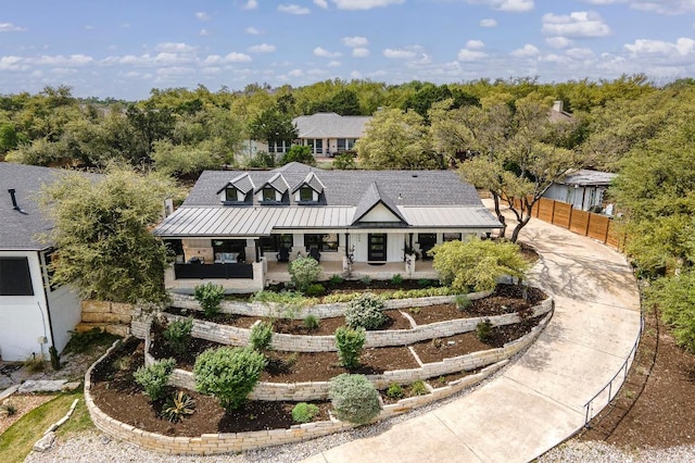 509 Flamingo Blvd, Lakeway, TX 78734 - rear view of house with a porch, a metal roof, and a standing seam roof
