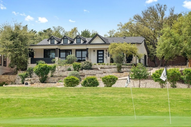 509 Flamingo Blvd, Lakeway, TX 78734 - view of front of house featuring a front yard, an area to practice putting, and view of golf course