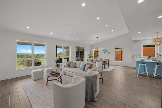 509 Flamingo Blvd, Lakeway, TX 78734 - living room with vaulted ceiling, recessed lighting, and wood finished floors
