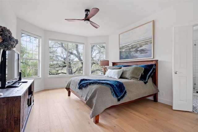 102 Hurst Creek Rd, Lakeway, TX 78734 - bedroom with light wood-style floors, baseboards, and multiple windows