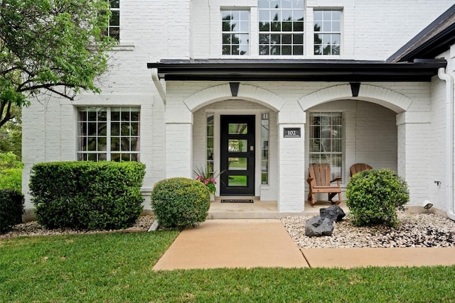 102 Hurst Creek Rd, Lakeway, TX 78734 - entrance to property featuring brick siding and covered porch