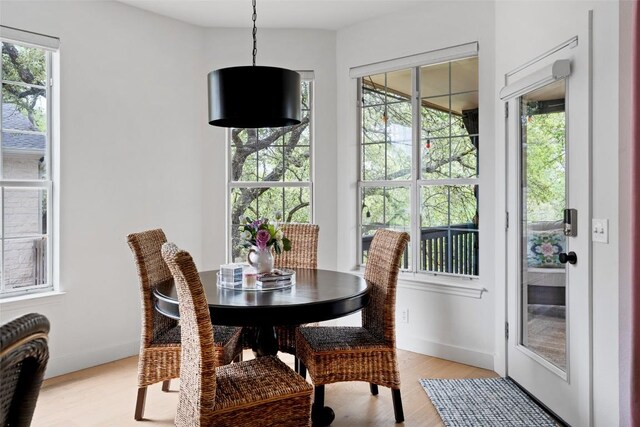 102 Hurst Creek Rd, Lakeway, TX 78734 - dining area featuring light wood finished floors and baseboards