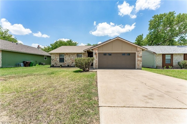 513 Purple Sage Dr, Round Rock, TX 78681 - view of front of house with stone siding, an attached garage, concrete driveway, a front yard, and board and batten siding